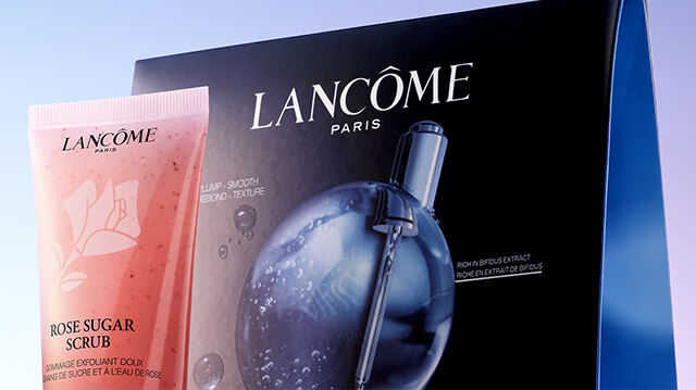 Productos para el cuidado de la piel Lancome, incluyendo mascarillas y exfoliantes, presentados en un diseno minimalista y moderno.